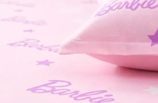 Barbie Star Single Bedsheet close-up showing pink cotton fabric with purple Barbie script logo and star pattern details