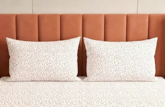 Blush Safari leopard print bed sheets and pillowcases on king size bed with coral velvet headboard, pink and purple animal print cotton bedding