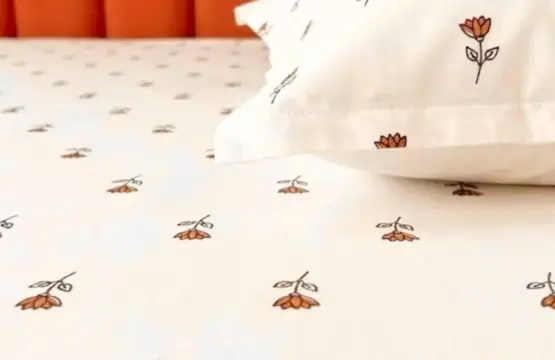Close-up of Meadow Whisper cotton bedsheet showing delicate floral pattern and premium cotton texture