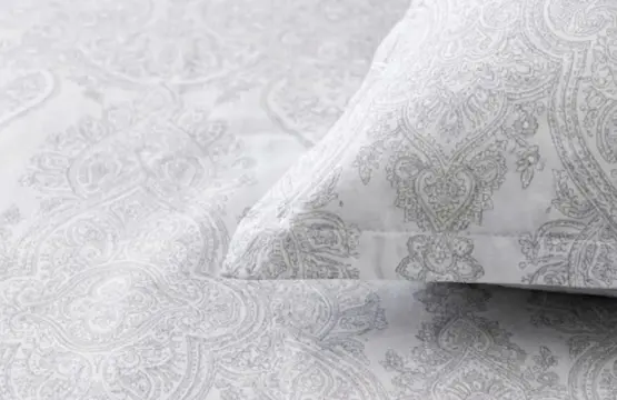 "Close-up of Cloud White King Size Cotton Bedsheet showing detailed paisley pattern and fabric texture